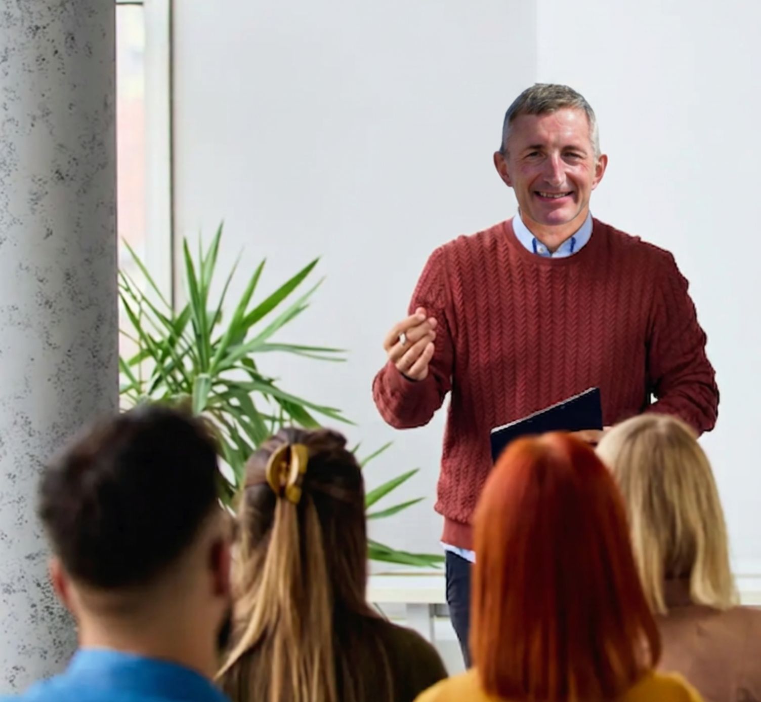 Tim Woodman speaking to a seated audience